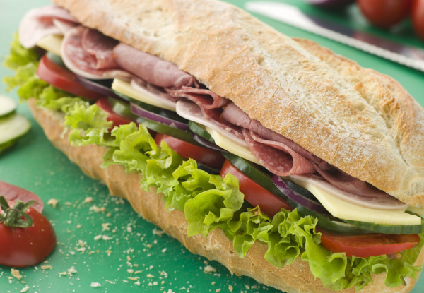 Deli Sub Sandwich on a Chopping Board