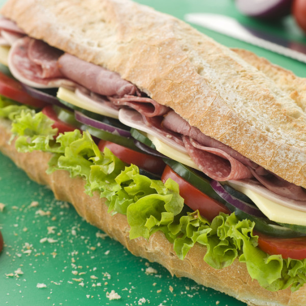 Deli Sub Sandwich on a Chopping Board